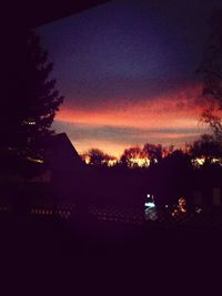 Silhouette of built structures at sunset