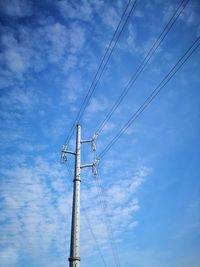 Low angle view of cables against sky