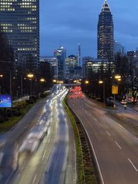 Illuminated city street at night