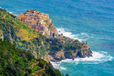 High angle view of sea by buildings