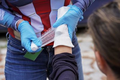 Midsection of woman holding hands
