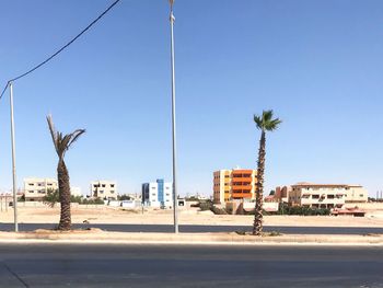 Road by street against clear sky