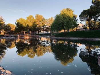 Reflection of trees in lake against sky during autumn