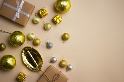 Directly above shot of christmas decorations on pink background