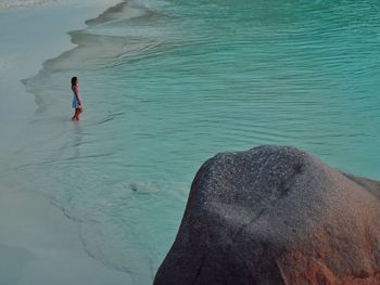 High angle view of man surfing in sea