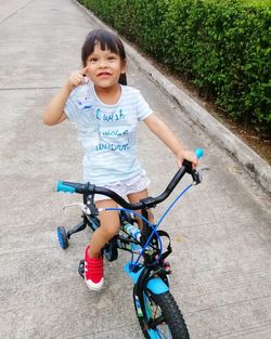 Portrait of boy riding bicycle