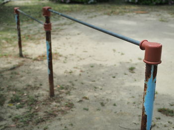 Close-up of metal pole on field