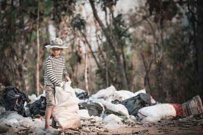 Rear view of a woman sitting on the ground