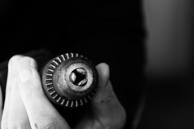 Close-up of hand holding machine