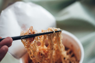 Close-up of hand holding bread