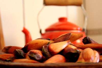 Close-up of fruits in container on table