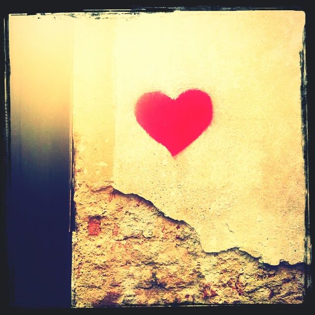 transfer print, red, auto post production filter, heart shape, wall - building feature, close-up, textured, wall, creativity, no people, art and craft, vignette, art, love, paint, human representation, day, ideas, outdoors, copy space