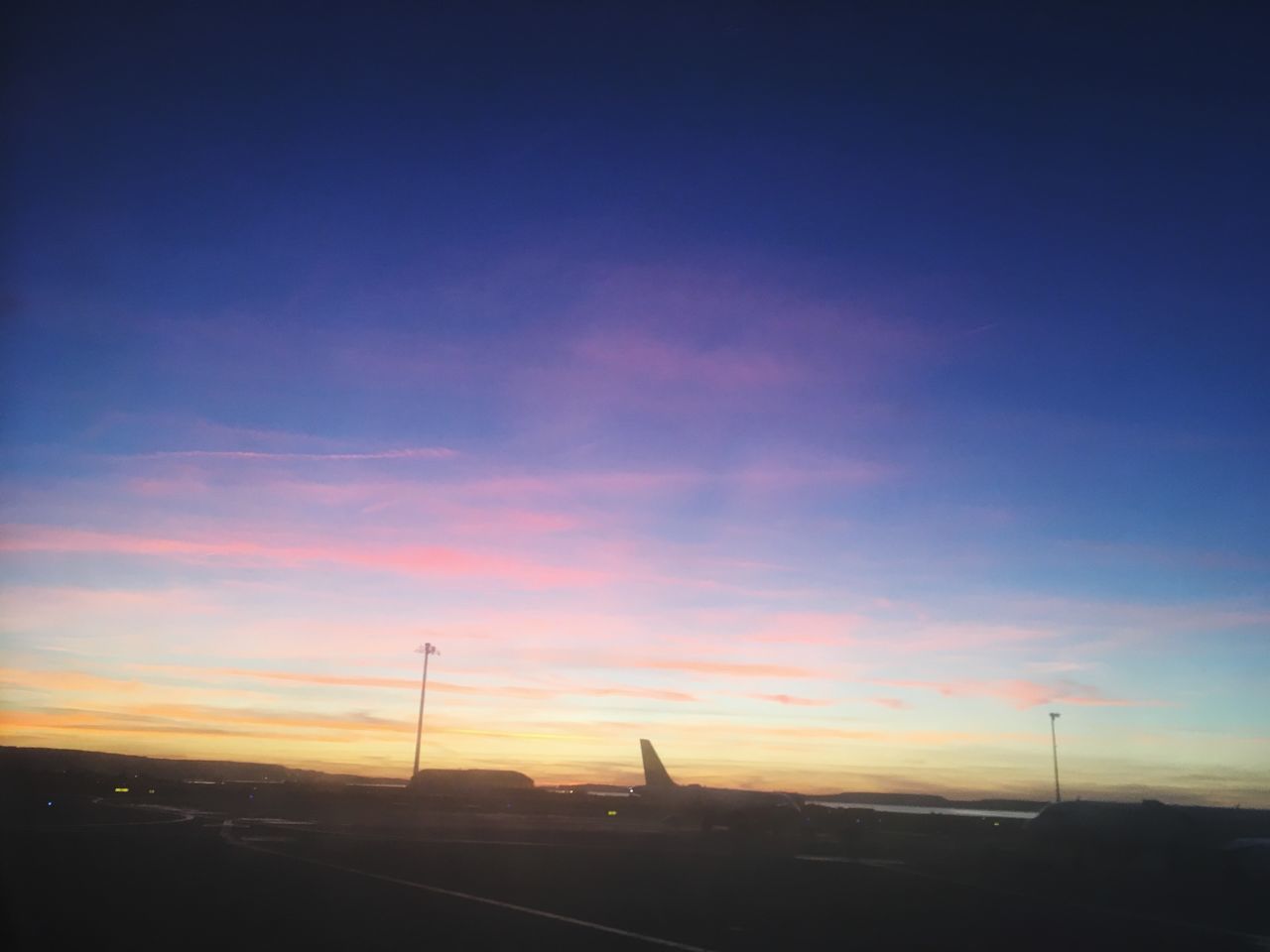 ROAD AGAINST SKY AT SUNSET