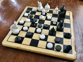 High angle view of chess pieces on table