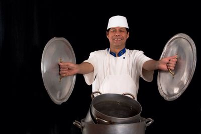 Close-up of woman holding camera