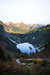 Scenic view of lake and mountains against clear sky