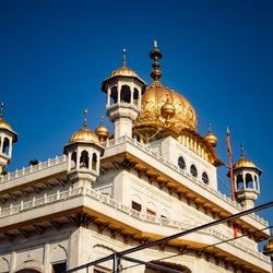 Low angle view of church against clear blue sky