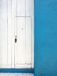 Closed blue door of building