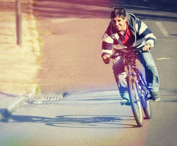 Young woman riding bicycle