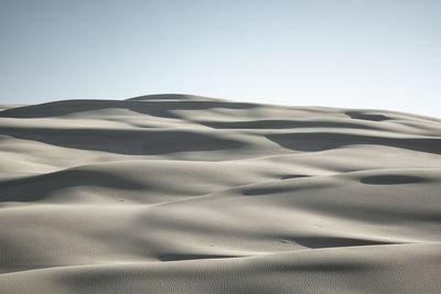 Scenic view of desert against clear sky