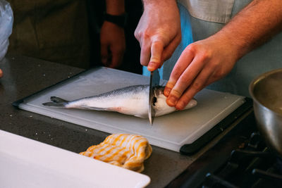 Midsection of man preparing food