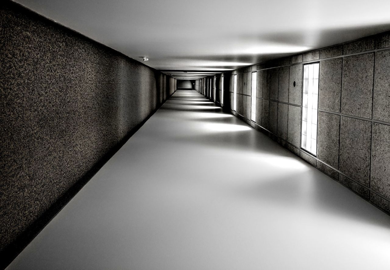 the way forward, direction, architecture, indoors, illuminated, empty, arcade, corridor, wall - building feature, built structure, no people, diminishing perspective, ceiling, flooring, tunnel, wall, building, lighting equipment, absence, footpath, underpass, long, light, underground walkway