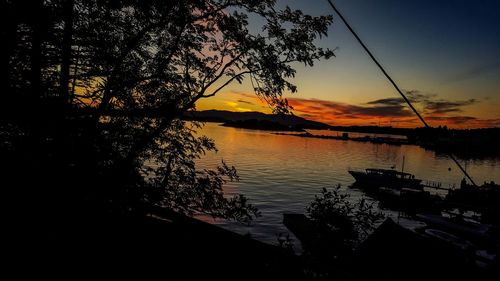 Scenic view of lake at sunset