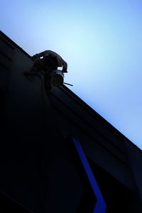 Low angle view of built structure against clear blue sky