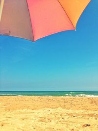 View of beach against blue sky