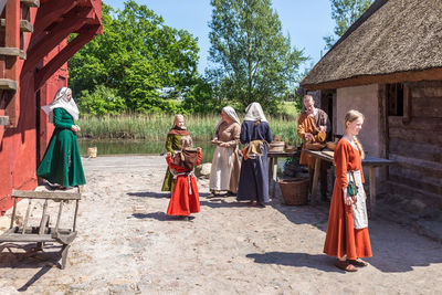 Group of people against built structure