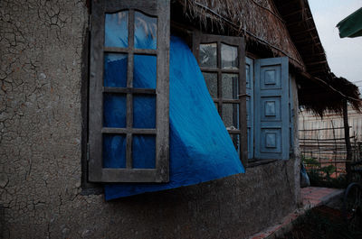 Low angle view of window on old building