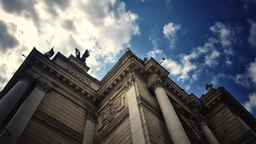 Low angle view of statue against cloudy sky