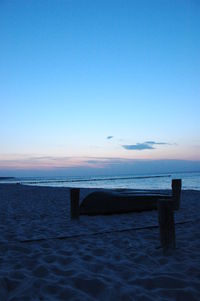 Scenic view of sea against clear sky at sunset