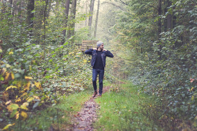 Woman walking in forest