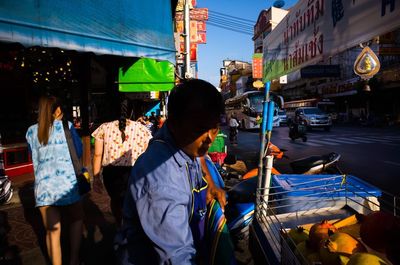 People walking on street in city