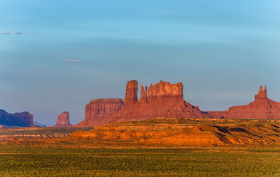 Rock formations on landscape against sky