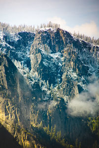 Aerial view of snowcapped mountains against sky