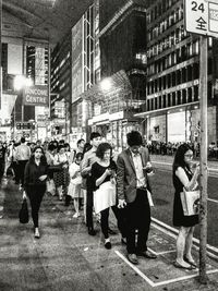 People walking on street in city