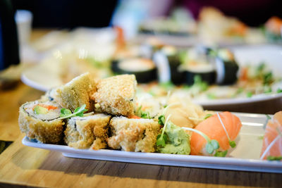 Close-up of sushi served on table