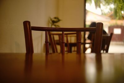 Close-up of wooden table and chair at home