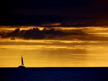 Scenic view of sea at sunset