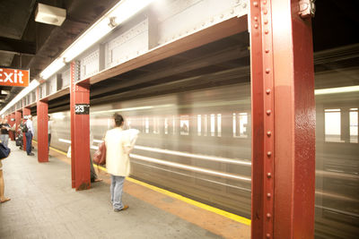 Speeding blurred train at railway station