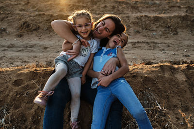 Portrait of happy friends on land