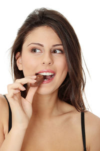 Portrait of a beautiful young woman over white background