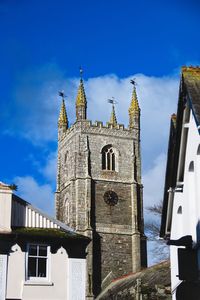 Low angle view of bell tower against sky