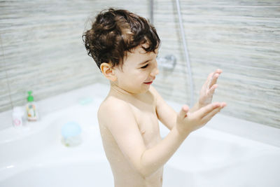A little boy bathes in a bath. personal hygiene in childhood. high quality photo