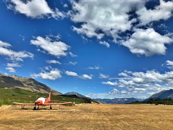 Scenic view of agricultural field against sky