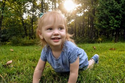 Baby girl on grassy land