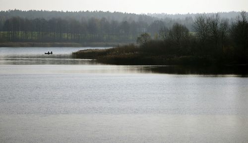 Scenic view of lake by trees