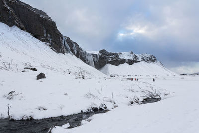 Scenic view of snow covered mountain against sky